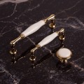 złote porcelanowe uchwyty do mebli asti orions giusti uchwyty do mebli z porcelaną porcelanowe uchwyty do kuchni glamour.jpg