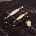 uchwyty do mebli w stylu glamour uchwyt porcelanowy złoty połysk (2).jpg